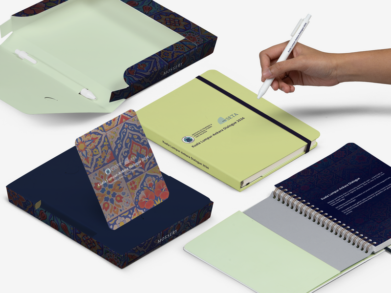 Stationery kit for ISIS conference: closed notebook, pens, cards