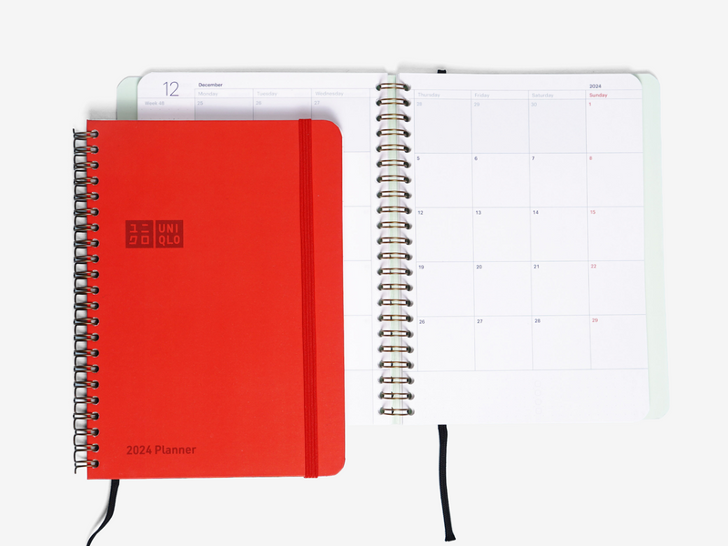 Customer merchandise set for Uniqlo: custom notebook and accessories, open