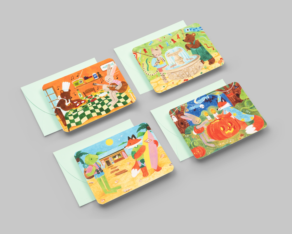 Four Clémence Guillemaud notecards laid out with their envelopes